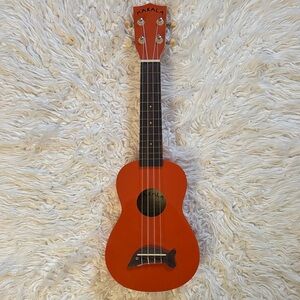 Makala Orange Ukulele with Dolphin Design